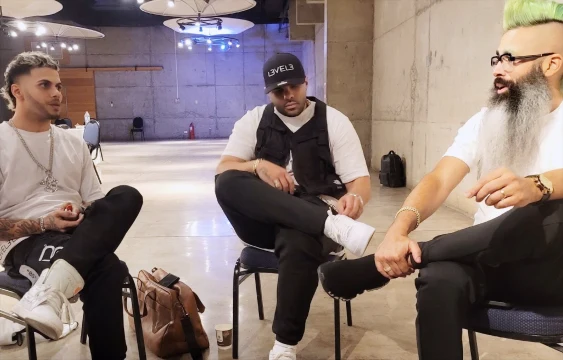 Three professionals in conversation
