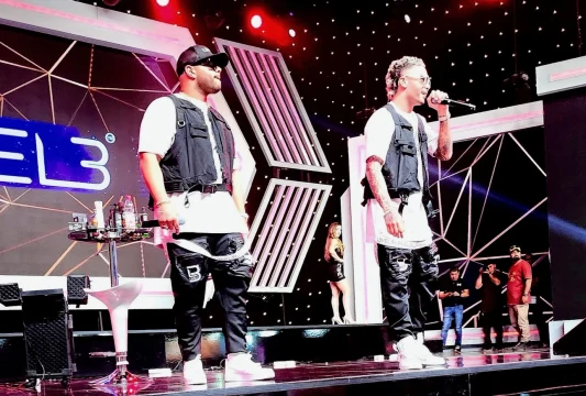 Two presenters on stage