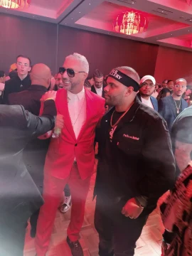 Two people posing at an event