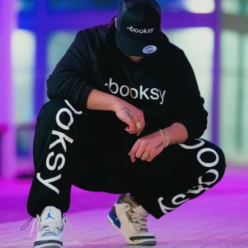 Portrait wearing Booksy clothing and cap