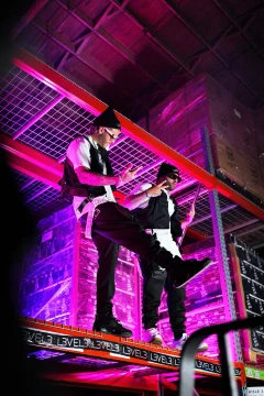 Two people under colored lights