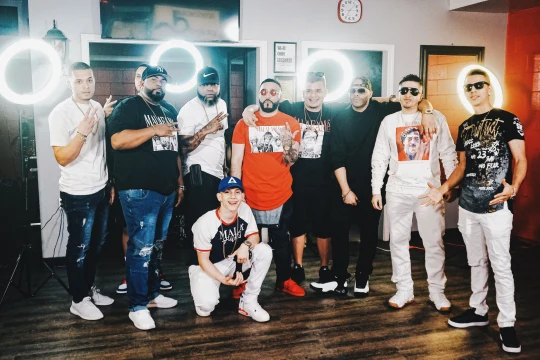 Elegance Barber Shop Crew gathered among ring lights for The Wave X Jairo Style.