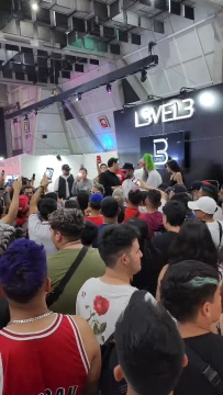 A team on a L3VEL3 stage in front of an audience.